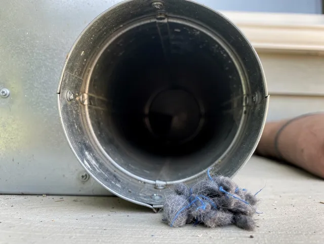 La Palma Dryer Vent Cleaning technician using specialized equipment to clear severe dryer vent blockage in La Palma